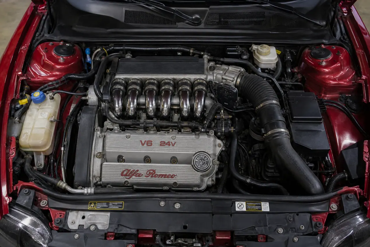 Alfa Romeo GTV 3.0 V6 Busso: emotion, reliability and buying truth Busso V6 engine-bay reference-reconstruction visual from the MxTicleCars provider package